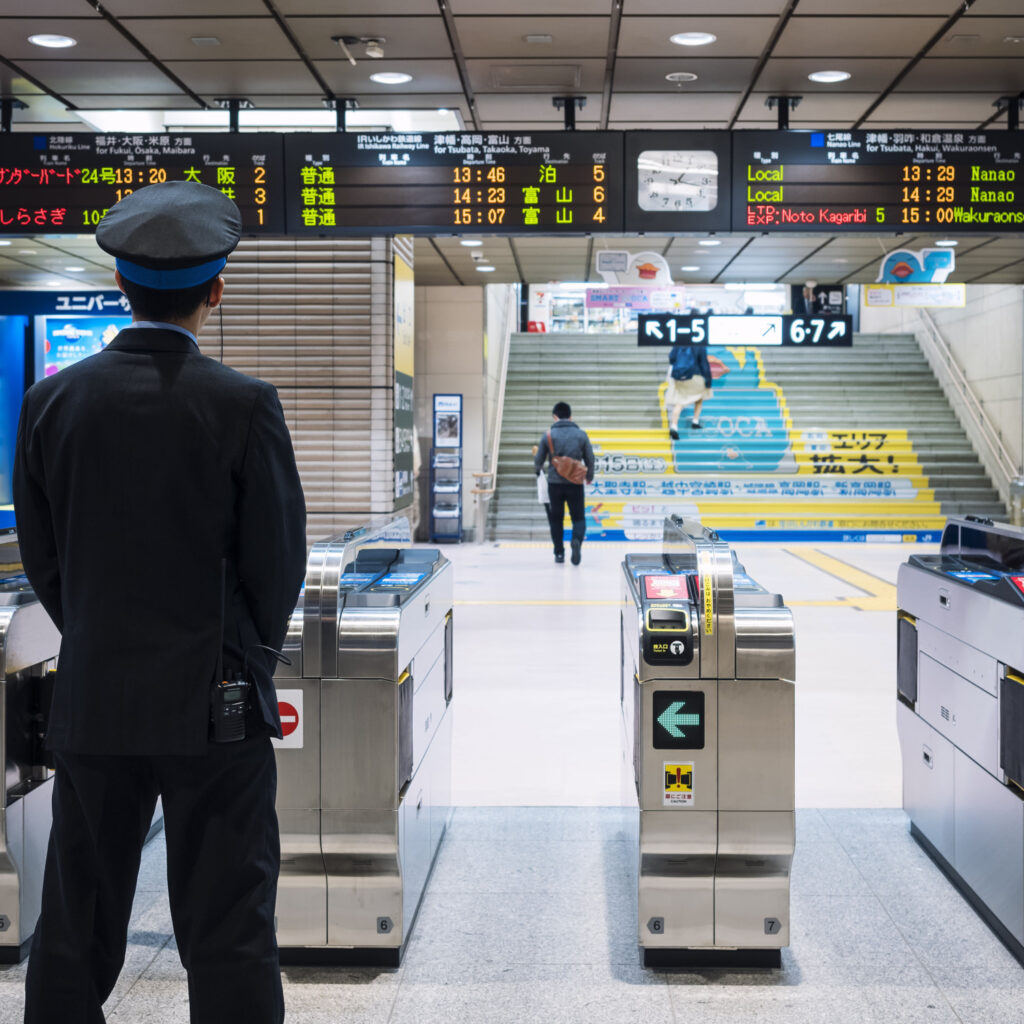 Osaka, Japan - April 11, 2017 : Shin Osaka Train station Ticket gate entrance with Train Ticket officer standing at Gate